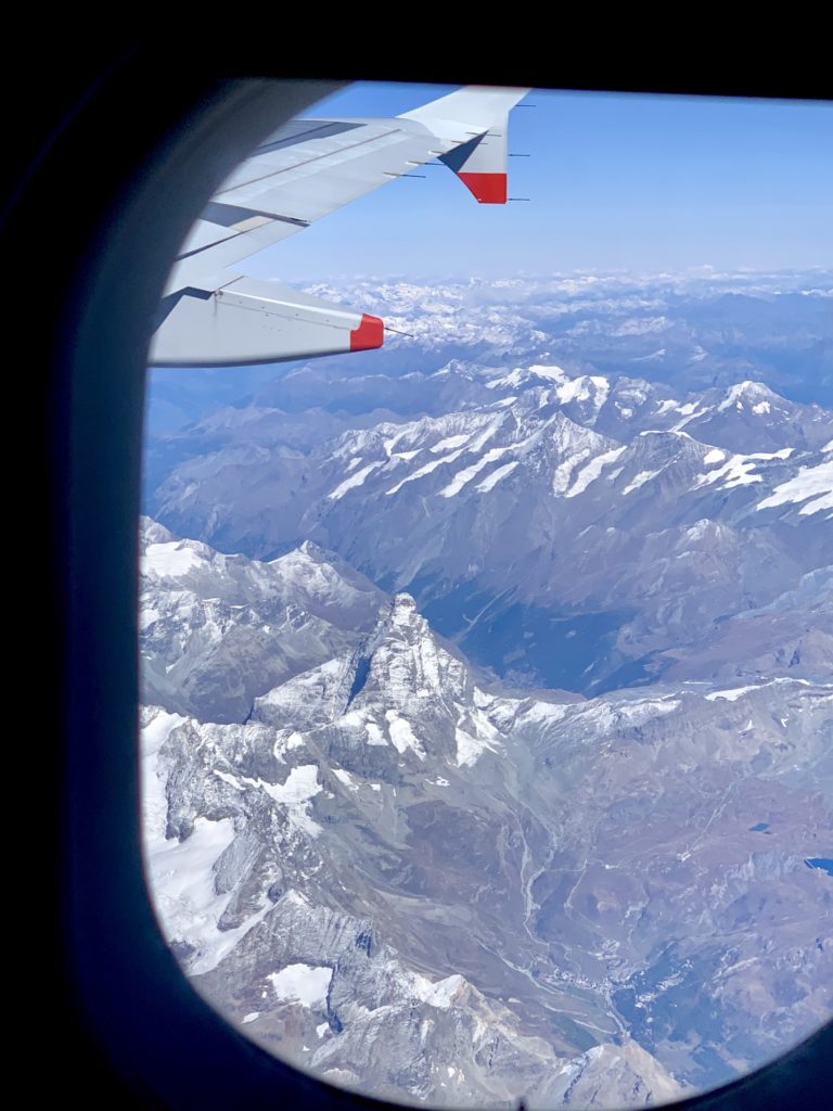 flying over Matterhorn and the Swiss alps from Milan - London - Los Angeles