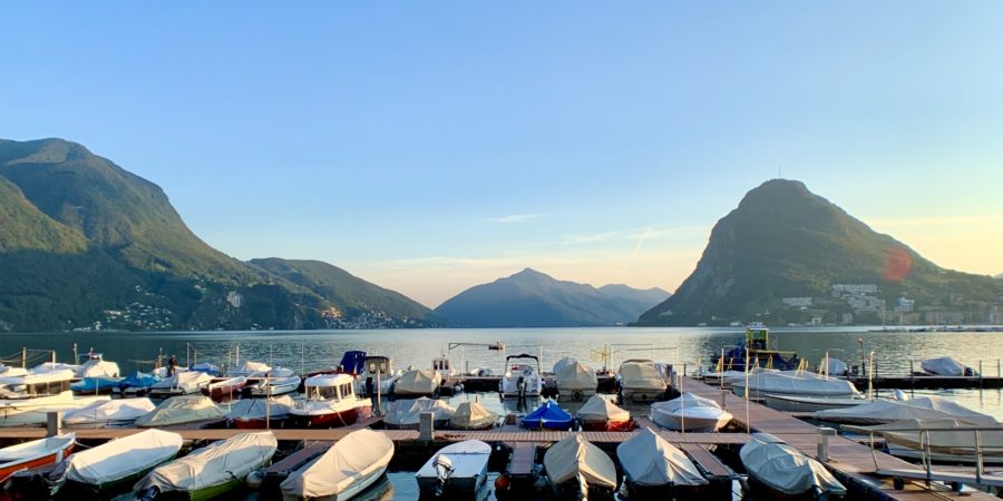Boats on Lake Lugano at Sunset in Switzerland